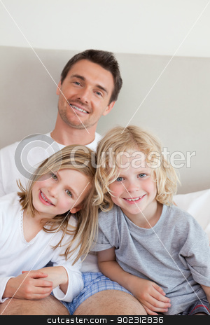 To use this stock image in your creative project, please select the size you need over to the right and click the "Add to Cart" button.
Your downloaded image will come with the Cutcaster watermark removed so don’t worry about the watermark you see on this page. Smiling father sitting on the bed with his children stock photo, Smiling father sitting the bed together with his children by Wavebreak Media