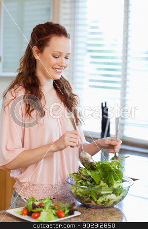 To use this stock image in your creative project, please select the size you need over to the right and click the "Add to Cart" button.
Your downloaded image will come with the Cutcaster watermark removed so don’t worry about the watermark you see on this page. Woman stirring bowl of salad stock photo, Woman stirring bowl of green salad by Wavebreak Media