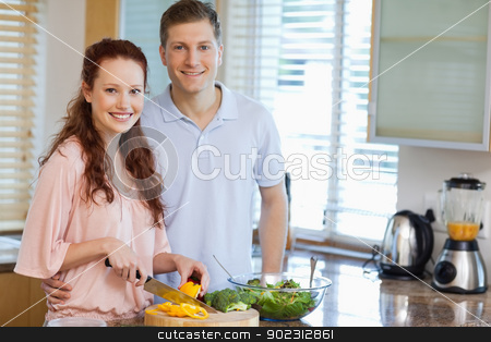 To use this stock image in your creative project, please select the size you need over to the right and click the "Add to Cart" button.
Your downloaded image will come with the Cutcaster watermark removed so don’t worry about the watermark you see on this page. Couple in the kitchen preparing salad stock photo, Smiling couple in the kitchen preparing salad by Wavebreak Media