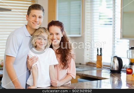 To use this stock image in your creative project, please select the size you need over to the right and click the "Add to Cart" button.
Your downloaded image will come with the Cutcaster watermark removed so don’t worry about the watermark you see on this page. Smiling family standing behind the kitchen counter stock photo, Smiling family standing behind the kitchen counter together by Wavebreak Media