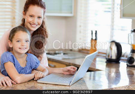 To use this stock image in your creative project, please select the size you need over to the right and click the "Add to Cart" button.
Your downloaded image will come with the Cutcaster watermark removed so don’t worry about the watermark you see on this page. Mother and daughter surfing the internet in the kitchen stock photo, Mother and daughter surfing the internet together in the kitchen by Wavebreak Media