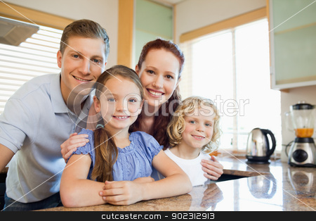 To use this stock image in your creative project, please select the size you need over to the right and click the "Add to Cart" button.
Your downloaded image will come with the Cutcaster watermark removed so don’t worry about the watermark you see on this page. Family standing together behind the kitchen counter stock photo, Smiling family standing together behind the kitchen counter by Wavebreak Media