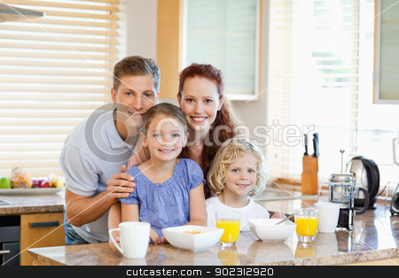 To use this stock image in your creative project, please select the size you need over to the right and click the "Add to Cart" button.
Your downloaded image will come with the Cutcaster watermark removed so don’t worry about the watermark you see on this page. Family together with breakfast standing behind the kitchen count stock photo, Young family together with breakfast standing behind the kitchen counter by Wavebreak Media