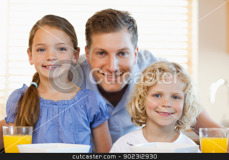 To use this stock image in your creative project, please select the size you need over to the right and click the "Add to Cart" button.
Your downloaded image will come with the Cutcaster watermark removed so don’t worry about the watermark you see on this page. Smiling father with his children in the kitchen stock photo, Smiling father together with his children in the kitchen by Wavebreak Media