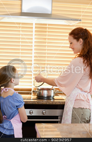 To use this stock image in your creative project, please select the size you need over to the right and click the "Add to Cart" button.
Your downloaded image will come with the Cutcaster watermark removed so don’t worry about the watermark you see on this page. Mother and daughter preparing meal stock photo, Mother and daughter preparing meal together by Wavebreak Media