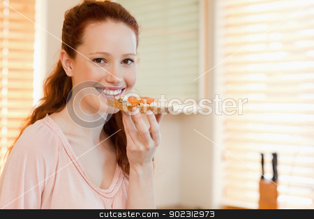 To use this stock image in your creative project, please select the size you need over to the right and click the "Add to Cart" button.
Your downloaded image will come with the Cutcaster watermark removed so don’t worry about the watermark you see on this page. Smiling woman with slice of bread stock photo, Smiling woman with slice of bread in her hand by Wavebreak Media