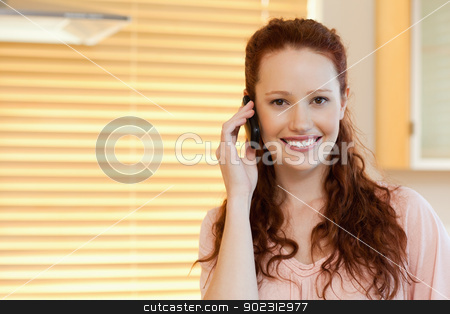 To use this stock image in your creative project, please select the size you need over to the right and click the "Add to Cart" button.
Your downloaded image will come with the Cutcaster watermark removed so don’t worry about the watermark you see on this page. Woman with cellphone in the kitchen stock photo, Smiling woman with cellphone in the kitchen by Wavebreak Media
