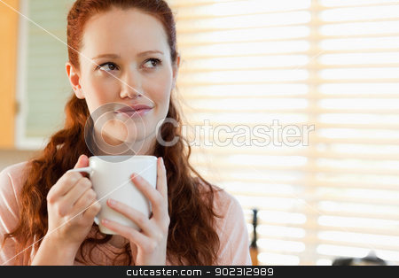 To use this stock image in your creative project, please select the size you need over to the right and click the "Add to Cart" button.
Your downloaded image will come with the Cutcaster watermark removed so don’t worry about the watermark you see on this page. Woman with a cup in thoughts stock photo, Young woman with a cup in thoughts by Wavebreak Media