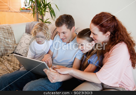 To use this stock image in your creative project, please select the size you need over to the right and click the "Add to Cart" button.
Your downloaded image will come with the Cutcaster watermark removed so don’t worry about the watermark you see on this page. Family using notebook on the sofa stock photo, Family using notebook on the sofa together by Wavebreak Media
