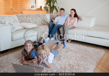 To use this stock image in your creative project, please select the size you need over to the right and click the "Add to Cart" button.
Your downloaded image will come with the Cutcaster watermark removed so don’t worry about the watermark you see on this page. Brother and sister with notebook on the carpet stock photo, Brother and sister together with notebook on the carpet by Wavebreak Media