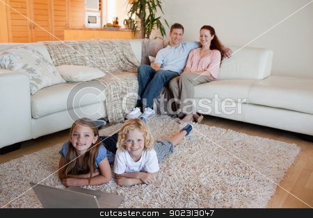 To use this stock image in your creative project, please select the size you need over to the right and click the "Add to Cart" button.
Your downloaded image will come with the Cutcaster watermark removed so don’t worry about the watermark you see on this page. Siblings with laptop on the floor stock photo, Siblings together with laptop on the floor by Wavebreak Media