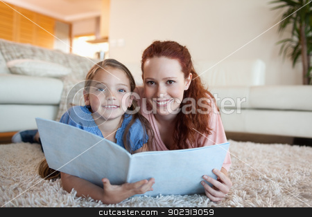 To use this stock image in your creative project, please select the size you need over to the right and click the "Add to Cart" button.
Your downloaded image will come with the Cutcaster watermark removed so don’t worry about the watermark you see on this page. Mother and daughter looking at periodical stock photo, Mother and daughter looking at periodical together by Wavebreak Media
