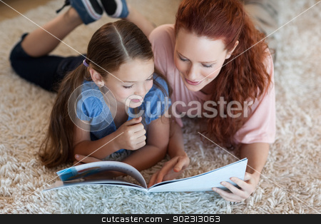 To use this stock image in your creative project, please select the size you need over to the right and click the "Add to Cart" button.
Your downloaded image will come with the Cutcaster watermark removed so don’t worry about the watermark you see on this page. Mother and daughter on the carpet reading stock photo, Mother and daughter on the carpet reading together by Wavebreak Media