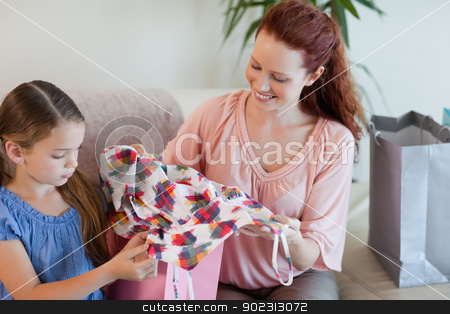 To use this stock image in your creative project, please select the size you need over to the right and click the "Add to Cart" button.
Your downloaded image will come with the Cutcaster watermark removed so don’t worry about the watermark you see on this page. Mother and daughter with shopping on the sofa stock photo, Mother and daughter with their shopping on the sofa by Wavebreak Media