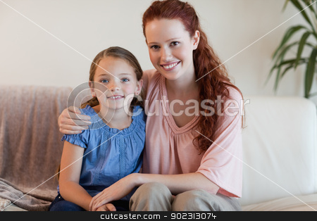 To use this stock image in your creative project, please select the size you need over to the right and click the "Add to Cart" button.
Your downloaded image will come with the Cutcaster watermark removed so don’t worry about the watermark you see on this page. Happy mother and daughter on the sofa stock photo, Happy smiling mother and daughter on the sofa by Wavebreak Media