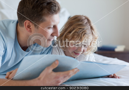 To use this stock image in your creative project, please select the size you need over to the right and click the "Add to Cart" button.
Your downloaded image will come with the Cutcaster watermark removed so don’t worry about the watermark you see on this page. Father and son reading stock photo, Father and son reading together by Wavebreak Media