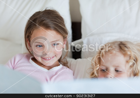 To use this stock image in your creative project, please select the size you need over to the right and click the "Add to Cart" button.
Your downloaded image will come with the Cutcaster watermark removed so don’t worry about the watermark you see on this page. Girl reading a fairy tale for her brother stock photo, Girl reading a fairy tale for her little brother by Wavebreak Media