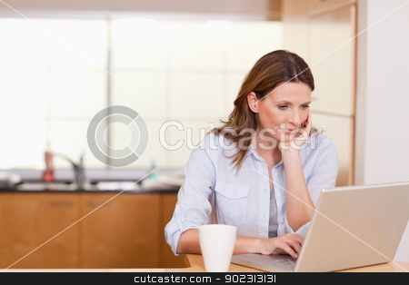 To use this stock image in your creative project, please select the size you need over to the right and click the "Add to Cart" button.
Your downloaded image will come with the Cutcaster watermark removed so don’t worry about the watermark you see on this page. Woman with her notebook in the kitchen stock photo, Woman with cup and her notebook in the kitchen by Wavebreak Media