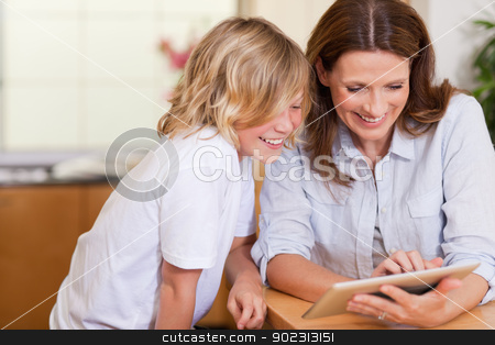 To use this stock image in your creative project, please select the size you need over to the right and click the "Add to Cart" button.
Your downloaded image will come with the Cutcaster watermark removed so don’t worry about the watermark you see on this page. Mother and son using tablet stock photo, Mother and son using tablet together by Wavebreak Media