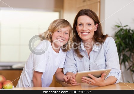 To use this stock image in your creative project, please select the size you need over to the right and click the "Add to Cart" button.
Your downloaded image will come with the Cutcaster watermark removed so don’t worry about the watermark you see on this page. Woman and her son using tablet stock photo, Woman and her son using tablet together by Wavebreak Media