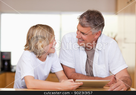 To use this stock image in your creative project, please select the size you need over to the right and click the "Add to Cart" button.
Your downloaded image will come with the Cutcaster watermark removed so don’t worry about the watermark you see on this page. Father and son with tablet stock photo, Father and son together with tablet by Wavebreak Media