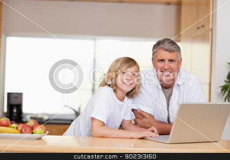 To use this stock image in your creative project, please select the size you need over to the right and click the "Add to Cart" button.
Your downloaded image will come with the Cutcaster watermark removed so don’t worry about the watermark you see on this page. Smiling father and son with laptop stock photo, Happy smiling father and son with laptop by Wavebreak Media
