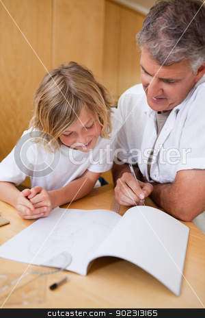 To use this stock image in your creative project, please select the size you need over to the right and click the "Add to Cart" button.
Your downloaded image will come with the Cutcaster watermark removed so don’t worry about the watermark you see on this page. Man explaining homework to son stock photo, Man explaining homework to his son by Wavebreak Media