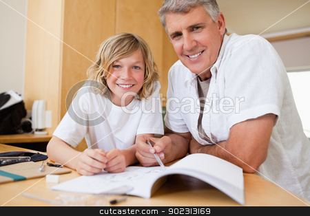 To use this stock image in your creative project, please select the size you need over to the right and click the "Add to Cart" button.
Your downloaded image will come with the Cutcaster watermark removed so don’t worry about the watermark you see on this page. Father helping son with his homework stock photo, Father helping his son with his homework by Wavebreak Media