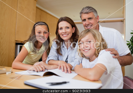To use this stock image in your creative project, please select the size you need over to the right and click the "Add to Cart" button.
Your downloaded image will come with the Cutcaster watermark removed so don’t worry about the watermark you see on this page. Parents helping their children with homework stock photo, Parents helping their children with their homework by Wavebreak Media