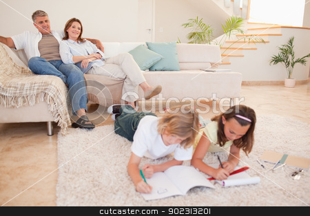 To use this stock image in your creative project, please select the size you need over to the right and click the "Add to Cart" button.
Your downloaded image will come with the Cutcaster watermark removed so don’t worry about the watermark you see on this page. Children doing homework with parents behind them stock photo, Children doing homework with their parents behind them by Wavebreak Media