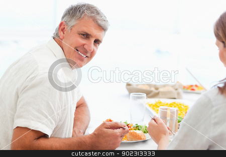 To use this stock image in your creative project, please select the size you need over to the right and click the "Add to Cart" button.
Your downloaded image will come with the Cutcaster watermark removed so don’t worry about the watermark you see on this page. Side view of happy smiling man during dinner stock photo, Side view of happy smiling mature man during dinner by Wavebreak Media
