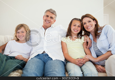 To use this stock image in your creative project, please select the size you need over to the right and click the "Add to Cart" button.
Your downloaded image will come with the Cutcaster watermark removed so don’t worry about the watermark you see on this page. Happy family sitting on the sofa stock photo, Happy family sitting on the sofa together by Wavebreak Media