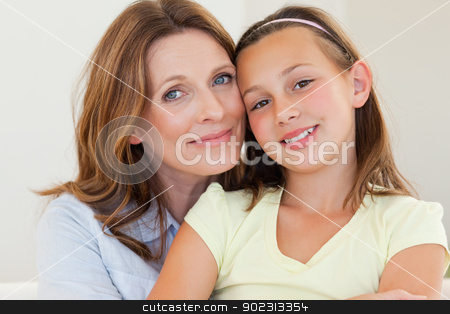 To use this stock image in your creative project, please select the size you need over to the right and click the "Add to Cart" button.
Your downloaded image will come with the Cutcaster watermark removed so don’t worry about the watermark you see on this page. Mother hugging her daughter stock photo, Smiling mother hugging her daughter by Wavebreak Media