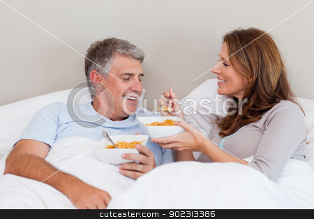 To use this stock image in your creative project, please select the size you need over to the right and click the "Add to Cart" button.
Your downloaded image will come with the Cutcaster watermark removed so don’t worry about the watermark you see on this page. Mature couple having breakfast in bed stock photo, Mature couple having breakfast in their bed by Wavebreak Media
