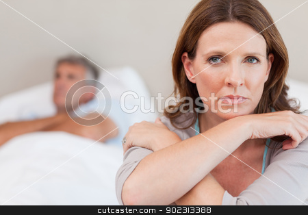 To use this stock image in your creative project, please select the size you need over to the right and click the "Add to Cart" button.
Your downloaded image will come with the Cutcaster watermark removed so don’t worry about the watermark you see on this page. Sad woman on the bed with husband in background stock photo, Sad woman on the bed with her husband in the background by Wavebreak Media