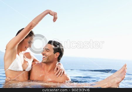 To use this stock image in your creative project, please select the size you need over to the right and click the "Add to Cart" button.
Your downloaded image will come with the Cutcaster watermark removed so don’t worry about the watermark you see on this page. Happy couple enjoying time together in the pool stock photo, Happy couple enjoying their time together in the pool by Wavebreak Media
