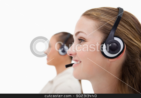 To use this stock image in your creative project, please select the size you need over to the right and click the "Add to Cart" button.
Your downloaded image will come with the Cutcaster watermark removed so don’t worry about the watermark you see on this page. Side view of operators using headsets stock photo, Side view of operators using headsets against a white background by Wavebreak Media