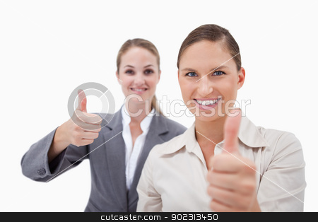 To use this stock image in your creative project, please select the size you need over to the right and click the "Add to Cart" button.
Your downloaded image will come with the Cutcaster watermark removed so don’t worry about the watermark you see on this page. Smiling sales persons posing with the thumb up stock photo, Smiling sales persons posing with the thumb up against a white background by Wavebreak Media
