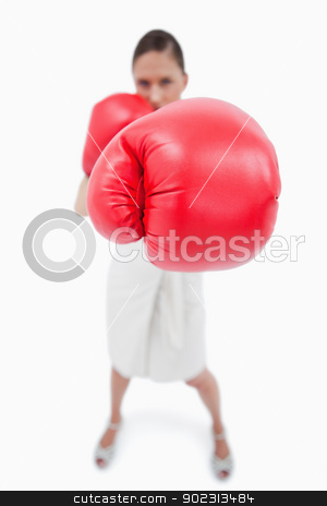 To use this stock image in your creative project, please select the size you need over to the right and click the "Add to Cart" button.
Your downloaded image will come with the Cutcaster watermark removed so don’t worry about the watermark you see on this page. Portrait of a boxing businesswoman stock photo, Portrait of a boxing businesswoman against a white background by Wavebreak Media