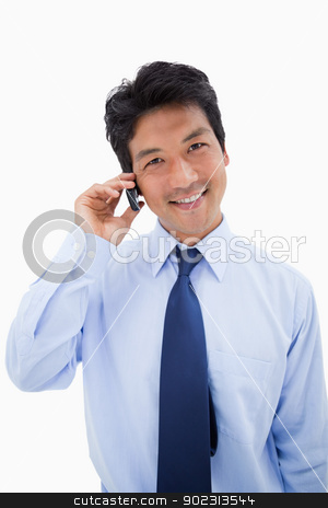 To use this stock image in your creative project, please select the size you need over to the right and click the "Add to Cart" button.
Your downloaded image will come with the Cutcaster watermark removed so don’t worry about the watermark you see on this page. Portrait of a smiling businessman making a phone call stock photo, Portrait of a smiling businessman making a phone call against a white background by Wavebreak Media