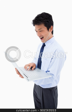 To use this stock image in your creative project, please select the size you need over to the right and click the "Add to Cart" button.
Your downloaded image will come with the Cutcaster watermark removed so don’t worry about the watermark you see on this page. Portrait of a surprised businessman using a laptop stock photo, Portrait of a surprised businessman using a laptop against a white background by Wavebreak Media