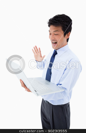 To use this stock image in your creative project, please select the size you need over to the right and click the "Add to Cart" button.
Your downloaded image will come with the Cutcaster watermark removed so don’t worry about the watermark you see on this page. Portrait of a businessman waving at a notebook stock photo, Portrait of a businessman waving at a notebook against a white background by Wavebreak Media