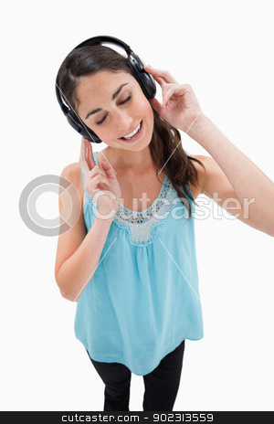 To use this stock image in your creative project, please select the size you need over to the right and click the "Add to Cart" button.
Your downloaded image will come with the Cutcaster watermark removed so don’t worry about the watermark you see on this page. Portrait of a delighted woman listening to music stock photo, Portrait of a delighted woman listening to music against a white background by Wavebreak Media