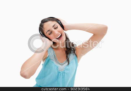 To use this stock image in your creative project, please select the size you need over to the right and click the "Add to Cart" button.
Your downloaded image will come with the Cutcaster watermark removed so don’t worry about the watermark you see on this page. Woman singing while listening to music stock photo, Woman singing while listening to music against a white background by Wavebreak Media