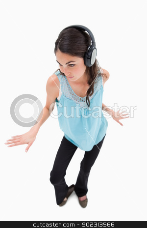 To use this stock image in your creative project, please select the size you need over to the right and click the "Add to Cart" button.
Your downloaded image will come with the Cutcaster watermark removed so don’t worry about the watermark you see on this page. Portrait of a happy woman dancing while listening to music stock photo, Portrait of a happy woman dancing while listening to music against a white background by Wavebreak Media