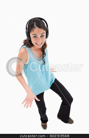 To use this stock image in your creative project, please select the size you need over to the right and click the "Add to Cart" button.
Your downloaded image will come with the Cutcaster watermark removed so don’t worry about the watermark you see on this page. Portrait of a joyful woman dancing while listening to music stock photo, Portrait of a joyful woman dancing while listening to music against a white background by Wavebreak Media