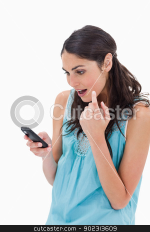 To use this stock image in your creative project, please select the size you need over to the right and click the "Add to Cart" button.
Your downloaded image will come with the Cutcaster watermark removed so don’t worry about the watermark you see on this page. Portrait of an amazed woman reading a text message stock photo, Portrait of an amazed woman reading a text message against a white background by Wavebreak Media
