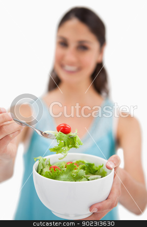 To use this stock image in your creative project, please select the size you need over to the right and click the "Add to Cart" button.
Your downloaded image will come with the Cutcaster watermark removed so don’t worry about the watermark you see on this page. Portrait of a woman showing a salad stock photo, Portrait of a woman showing a salad against a white background by Wavebreak Media