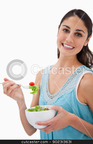 To use this stock image in your creative project, please select the size you need over to the right and click the "Add to Cart" button.
Your downloaded image will come with the Cutcaster watermark removed so don’t worry about the watermark you see on this page. Portrait of a young woman eating a salad stock photo, Portrait of a young woman eating a salad against a white background by Wavebreak Media