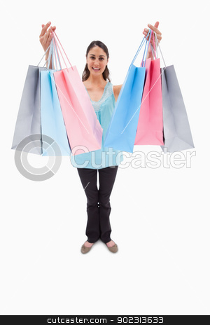 To use this stock image in your creative project, please select the size you need over to the right and click the "Add to Cart" button.
Your downloaded image will come with the Cutcaster watermark removed so don’t worry about the watermark you see on this page. Portrait of a woman showing shopping bags stock photo, Portrait of a woman showing shopping bags against a white background by Wavebreak Media
